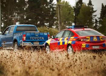 Police car pulling over ute