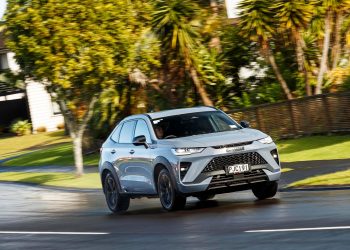 2022 Haval H6GT Ultra 4WD driving past houses