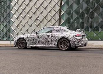 BMW M2 in camouflage side view