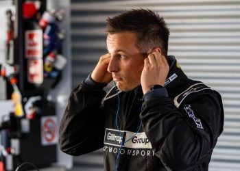 Simon Evans putting ear plugs in