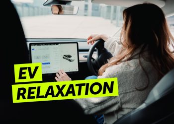 Person touching screen in Tesla Model 3