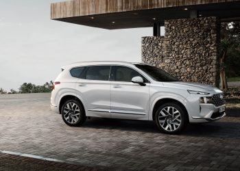 Hyundai Santa Fe Calligraphy parked by house