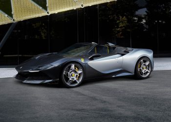 Ferrari SP-8 parked next to building
