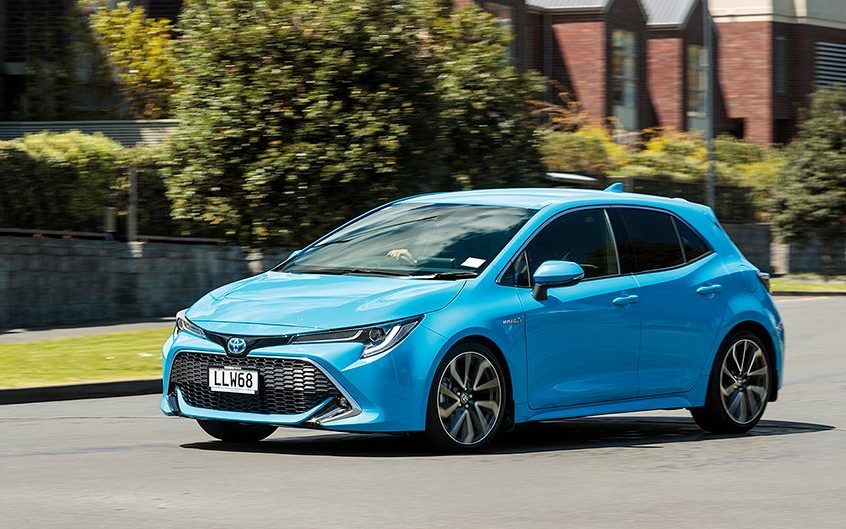 Toyota Corolla Hybrid ZR driving through residential area