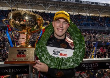 Matt Payne holding up Adelaide 500 race winning trophy