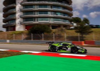 Lamborghini Huracan GT3 racing past building in Portimao