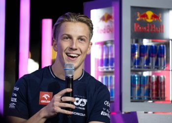 Liam Lawson holding microphone during interview