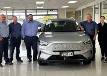 MG Northland team members standing around MG ZS EV
