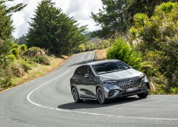 Mercedes-AMG-EQE-53 cornering, showing the front quarter angle of the silver car