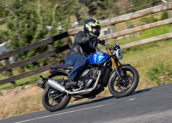 Triumph cornering at speed, blue
