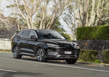 BYD Sealion 6 Dynamic hybrid SUV, taking a corner, in black