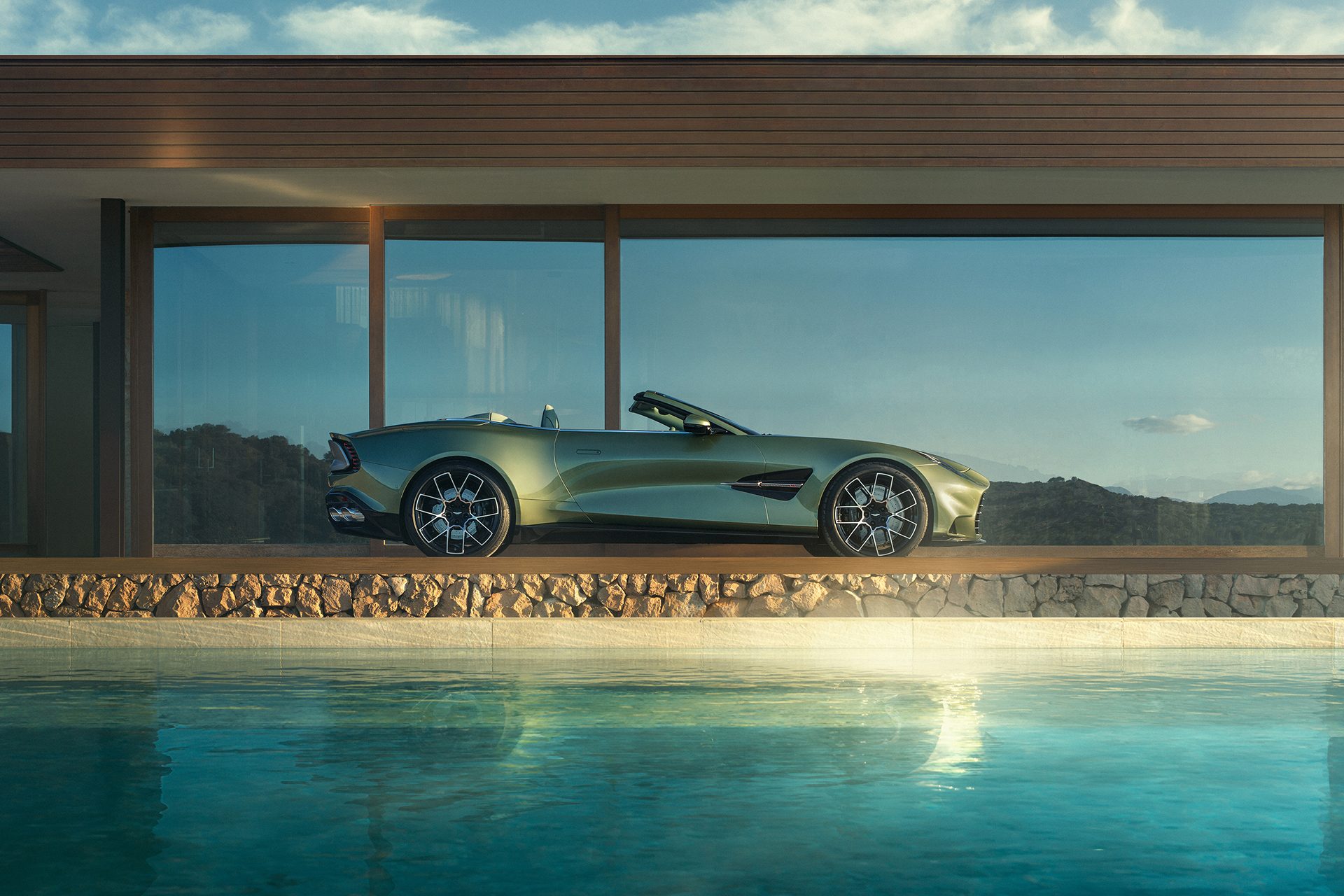 Aston Martin Vanquish Volante by the pool