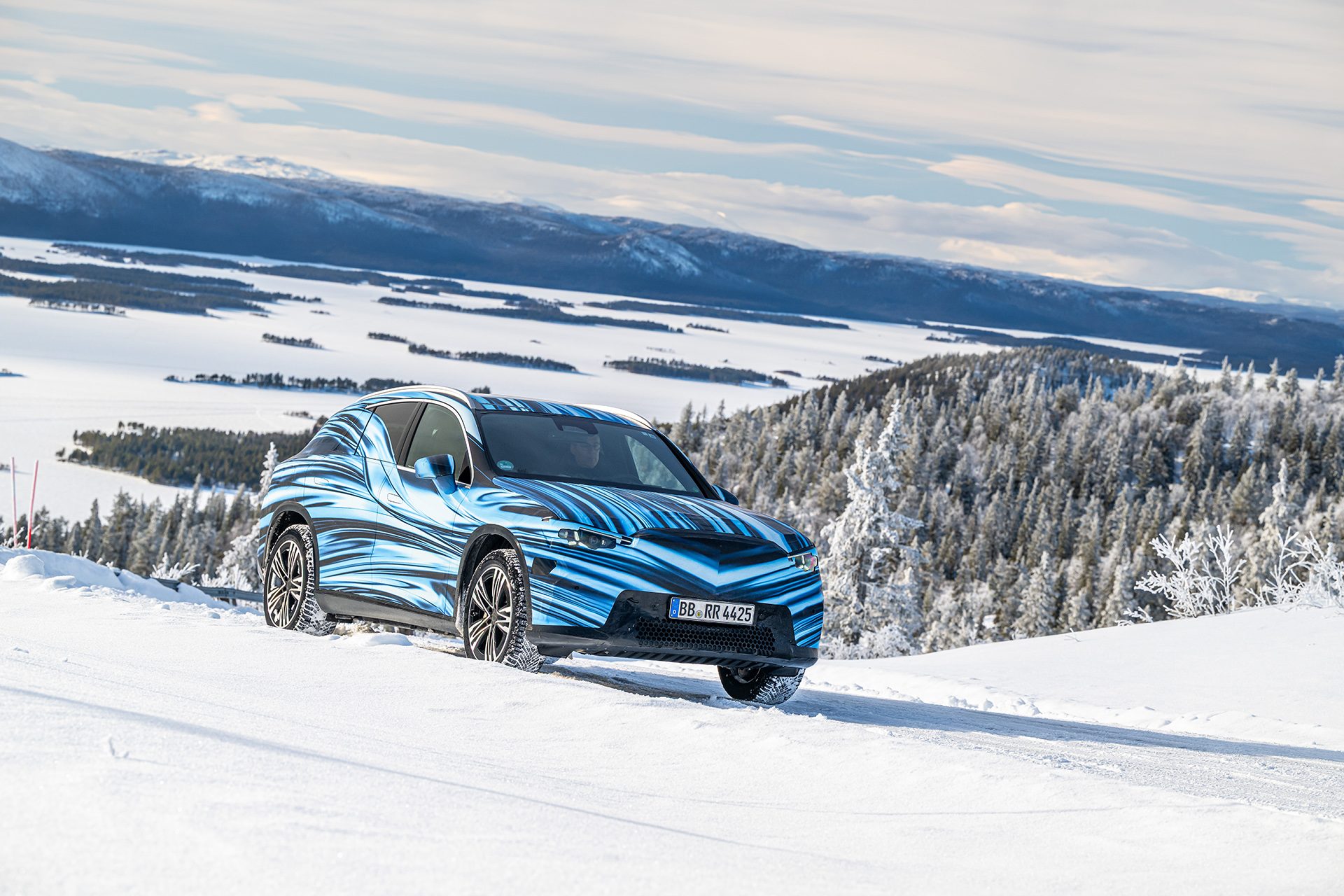 Mercedes-Benz GLC with EQ Technology in the snow with trees in the back ground