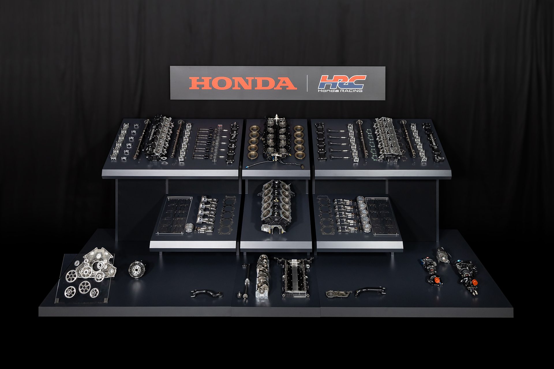 HRC Honda race parts from the V10 F1 engine on a black table