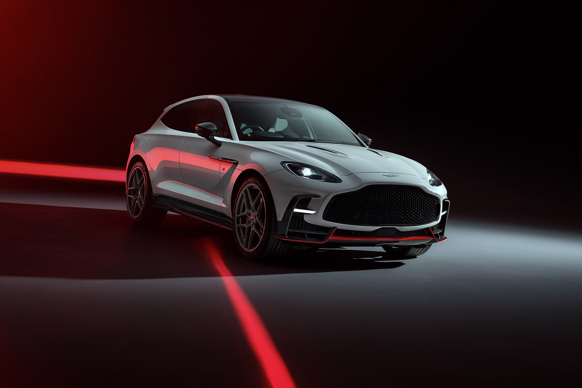 Aston Martin DBX S in white on a black back ground