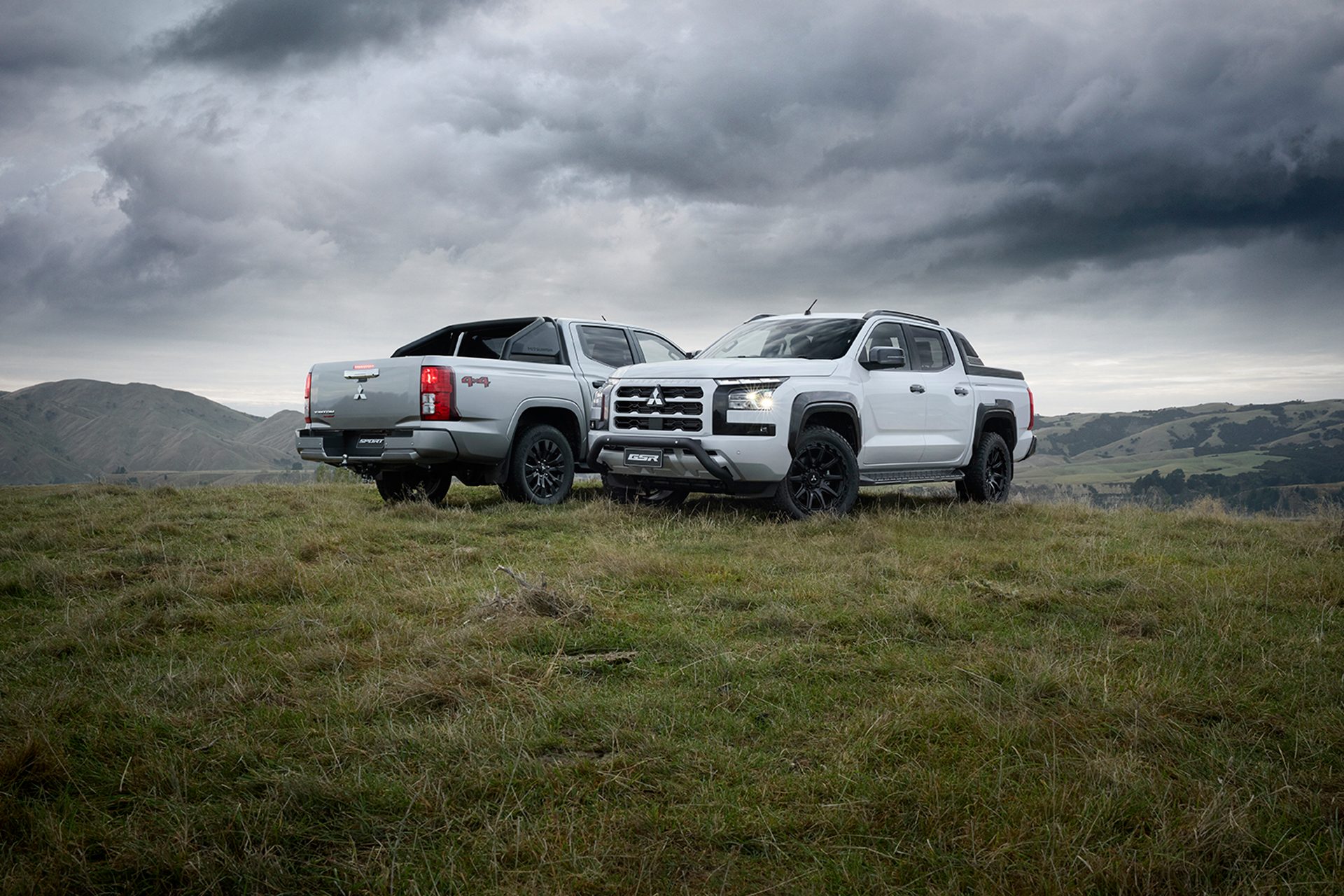 Tritons in a field under stormy skies