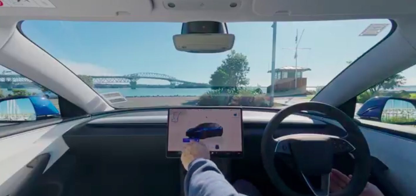 View of Auckland harbour bridge from a Tesla