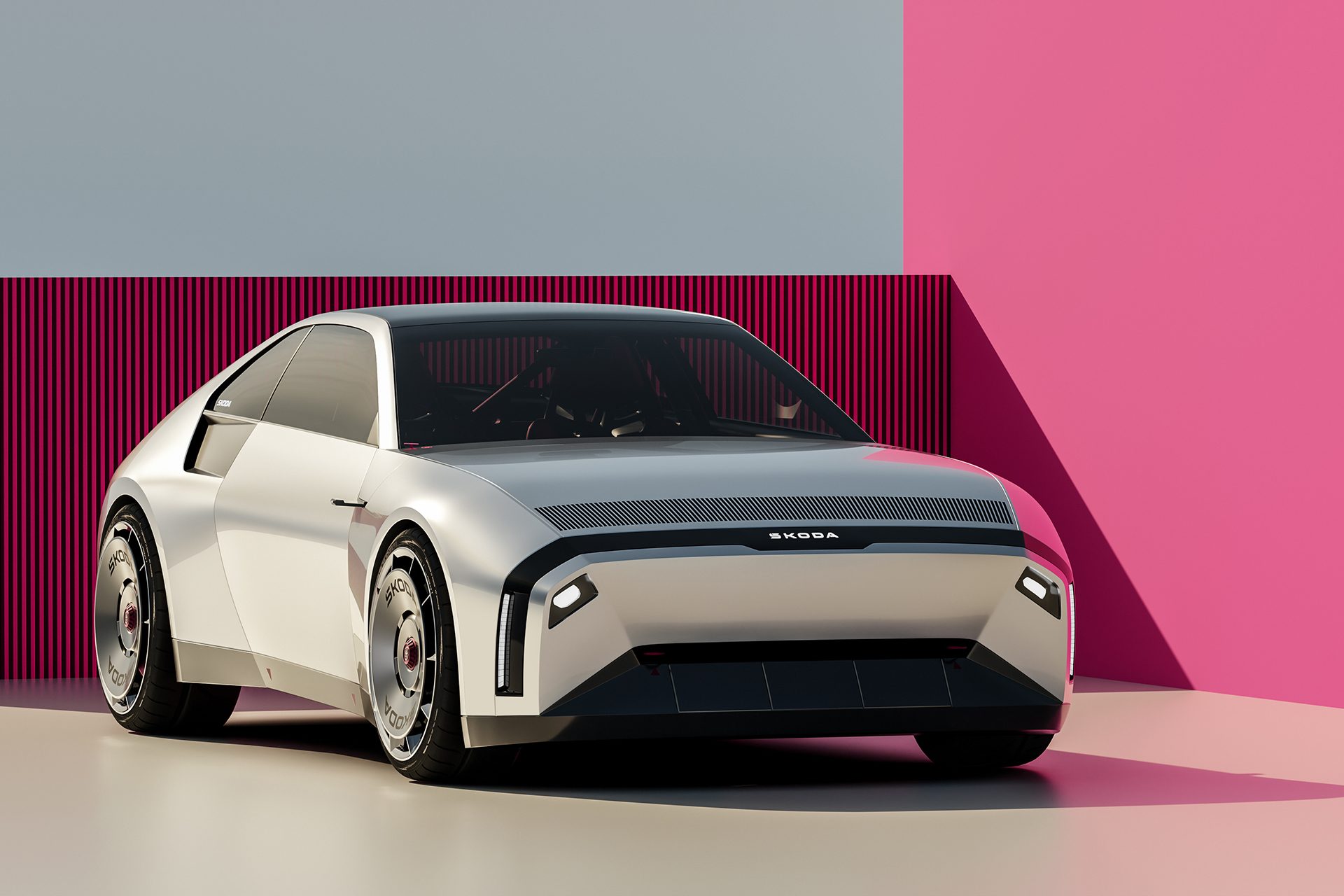 Skoda 110 R next to a pink wall