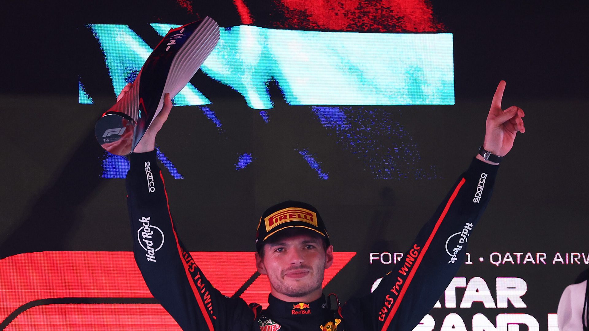 LUSAIL CITY, QATAR - NOVEMBER 30: Race winner Max Verstappen of the Netherlands and Oracle Red Bull Racing lifts his trophy on the podium during the F1 Grand Prix of Qatar at Lusail International Circuit on November 30, 2025 in Lusail City, Qatar. (Photo by Dom Gibbons/LAT Images) // Getty Images / Red Bull Content Pool // SI202511300701 // Usage for editorial use only //